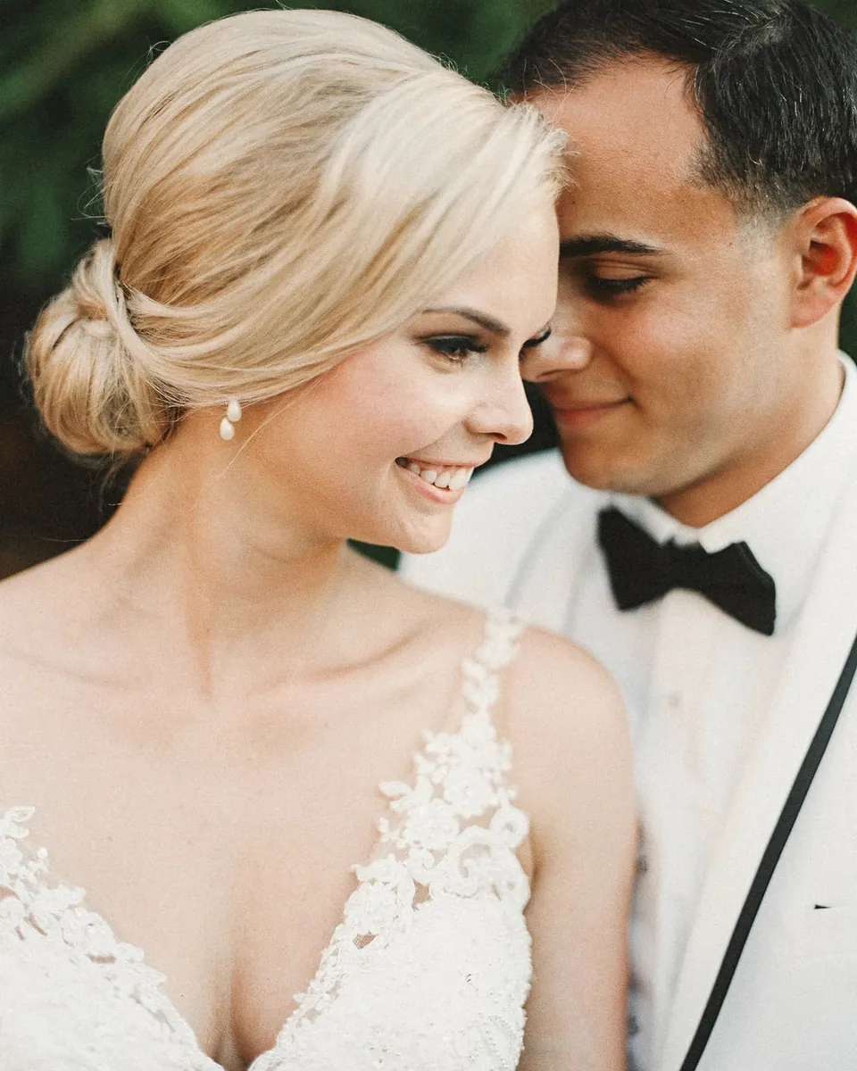 Bride and groom cheek to cheek in soft natural light, photographed on film by Jay Cassario