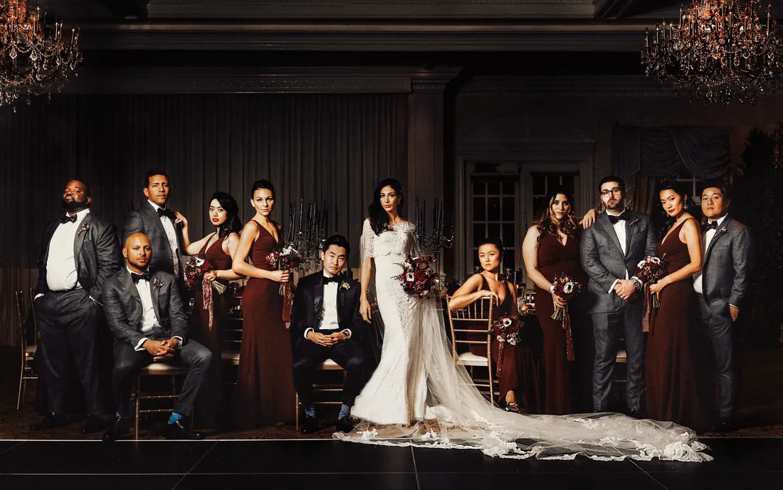 Dramatic bridal party portrait in deep red and gray