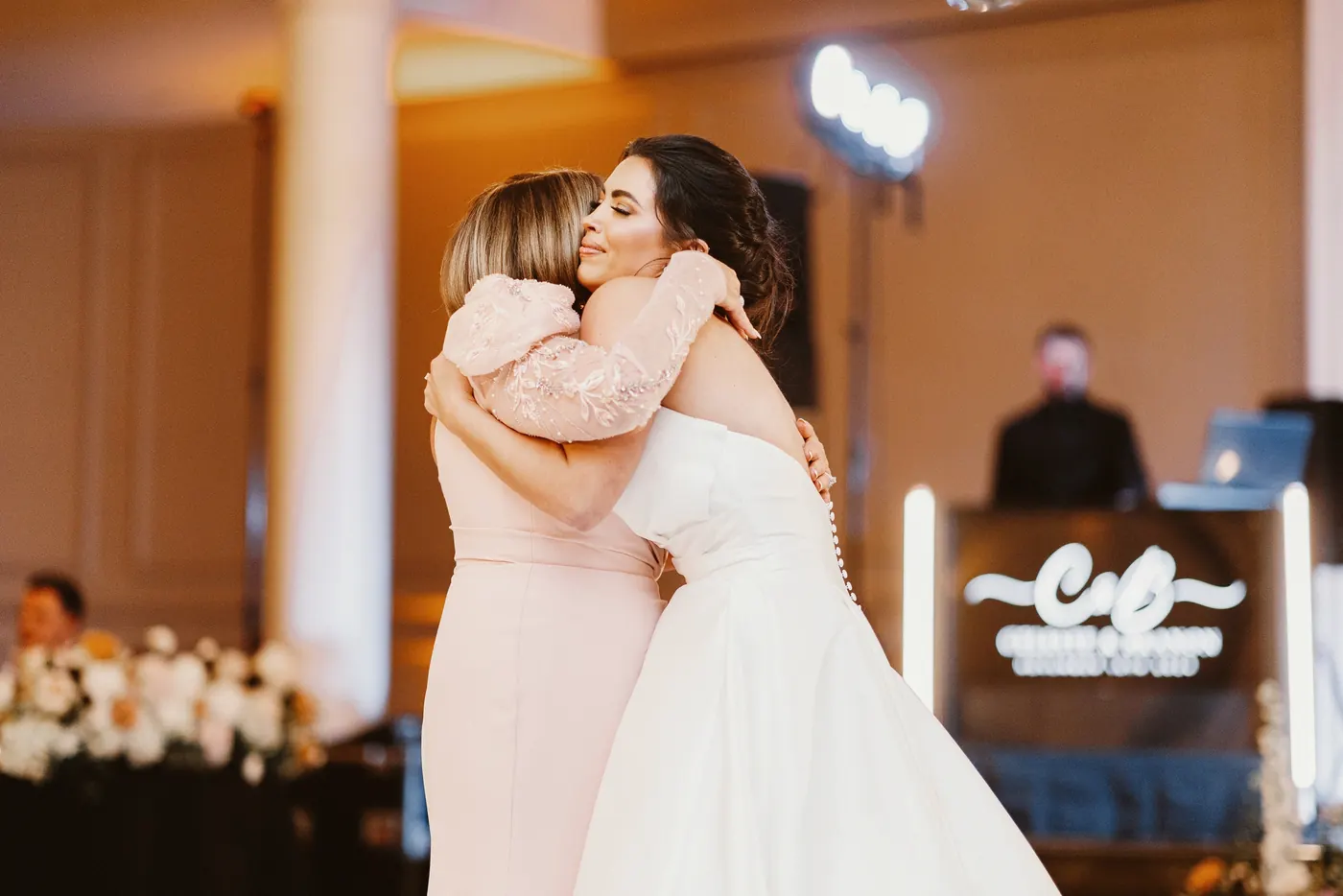 Celeste hugging her mom on the dance floor at The Vie by Cescaphe in Philadelphia