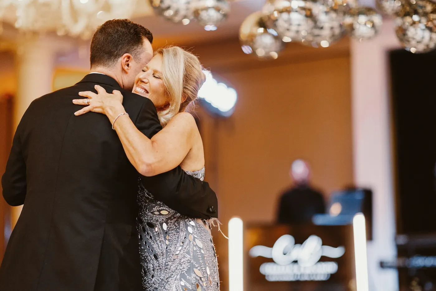 Branon hugging his mom during their dance at The Vie by Cescaphe in Philadelphia