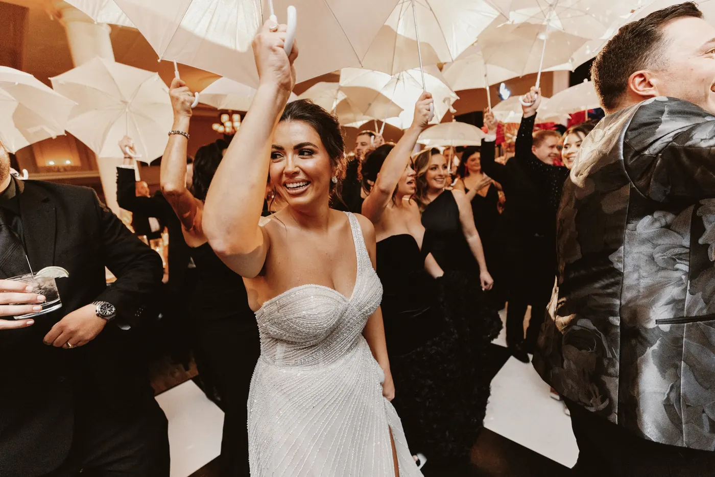 Celeste dancing in her sparkly second dress under the umbrellas at The Vie by Cescaphe in Philadelphia