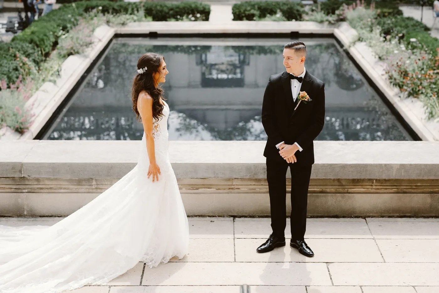 Chris smiling as he sees Danielle for the first time by the reflecting pool at the Rodin Museum in Philadelphia
