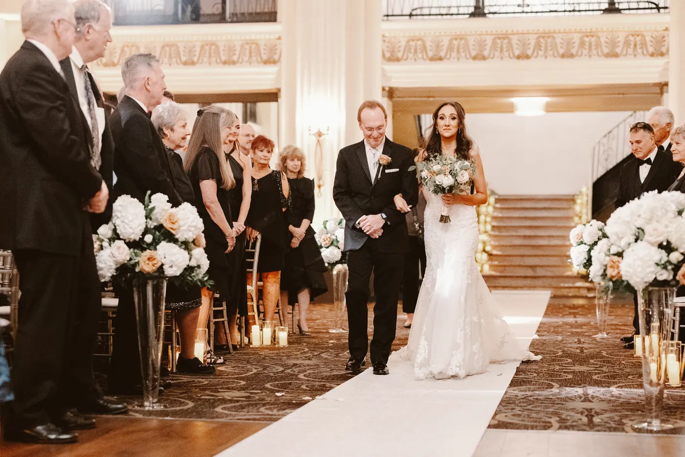 Danielle walking down the aisle with her father at Cescaphe Ballroom at the Ben in Philadelphia