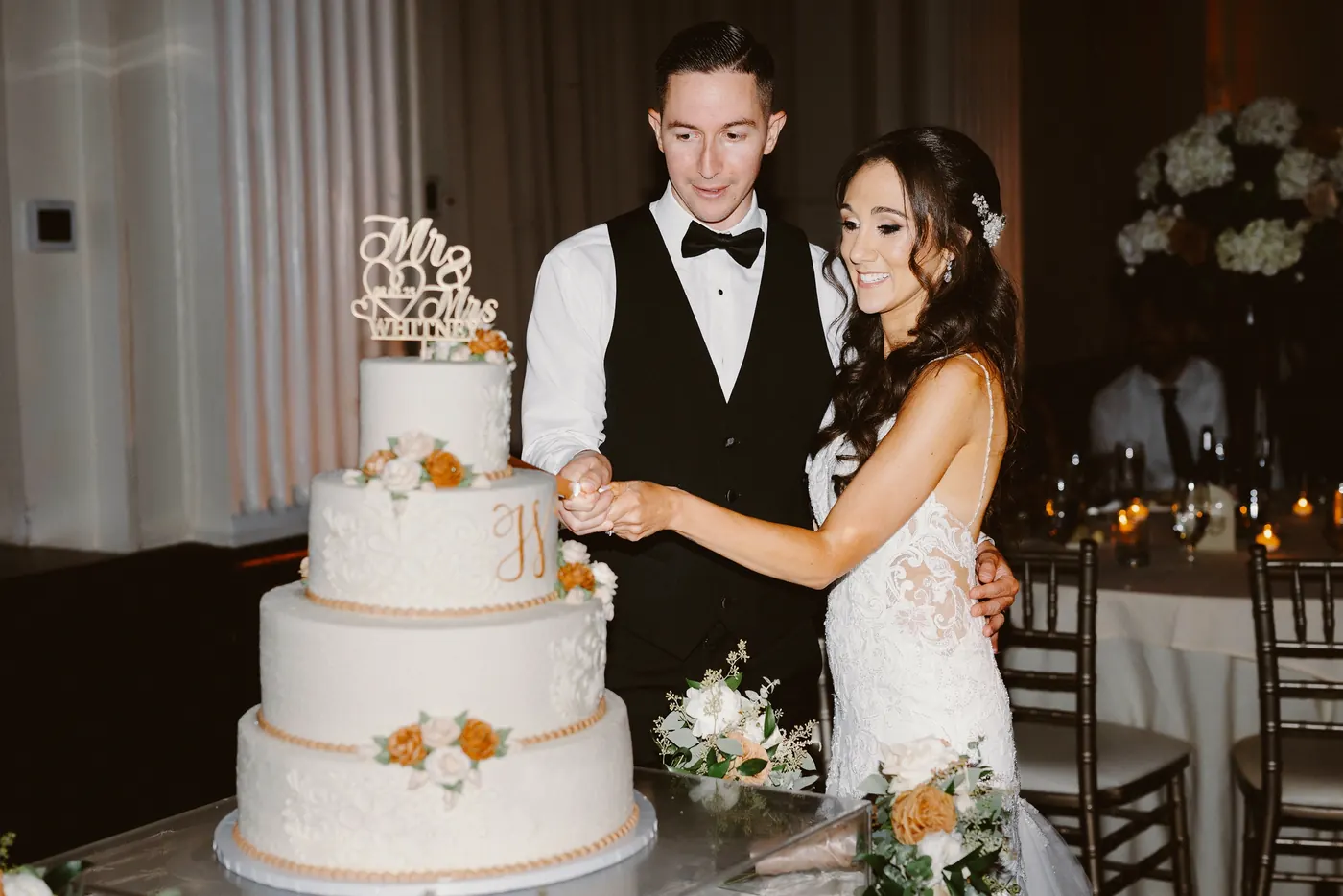 Chris and Danielle cutting their wedding cake at Cescaphe Ballroom at the Ben in Philadelphia