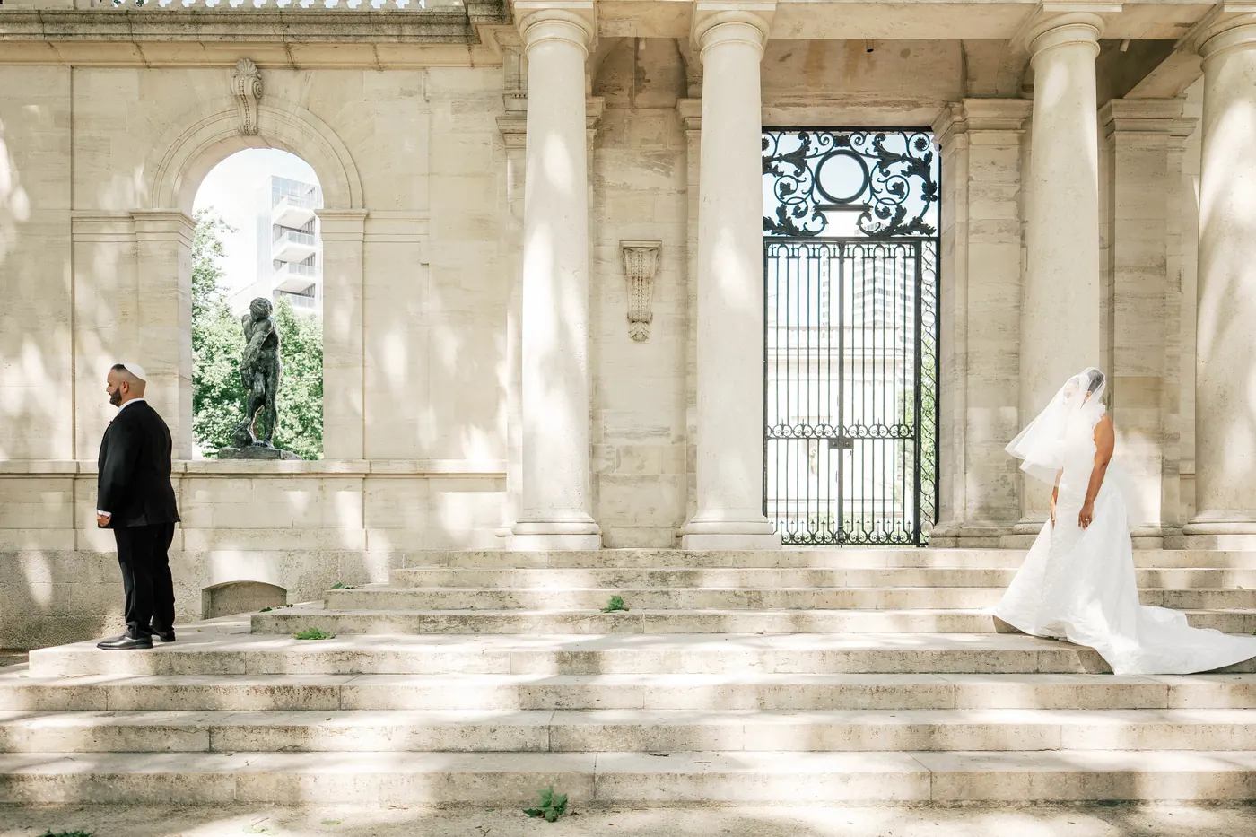 Gianna walking up the steps toward Simon for their first look at the Rodin Museum in Philadelphia