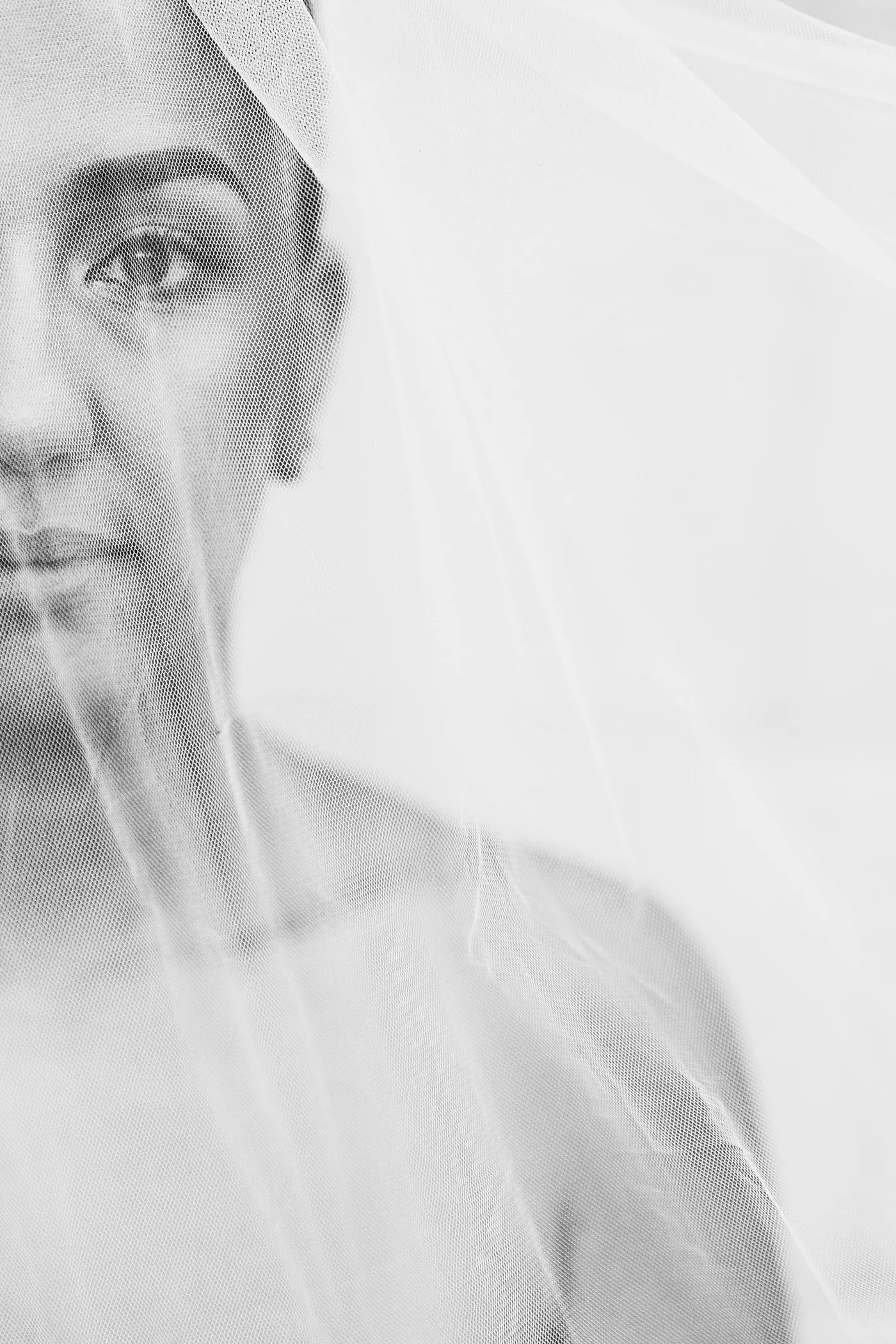 Black and white close-up of Gianna through her veil