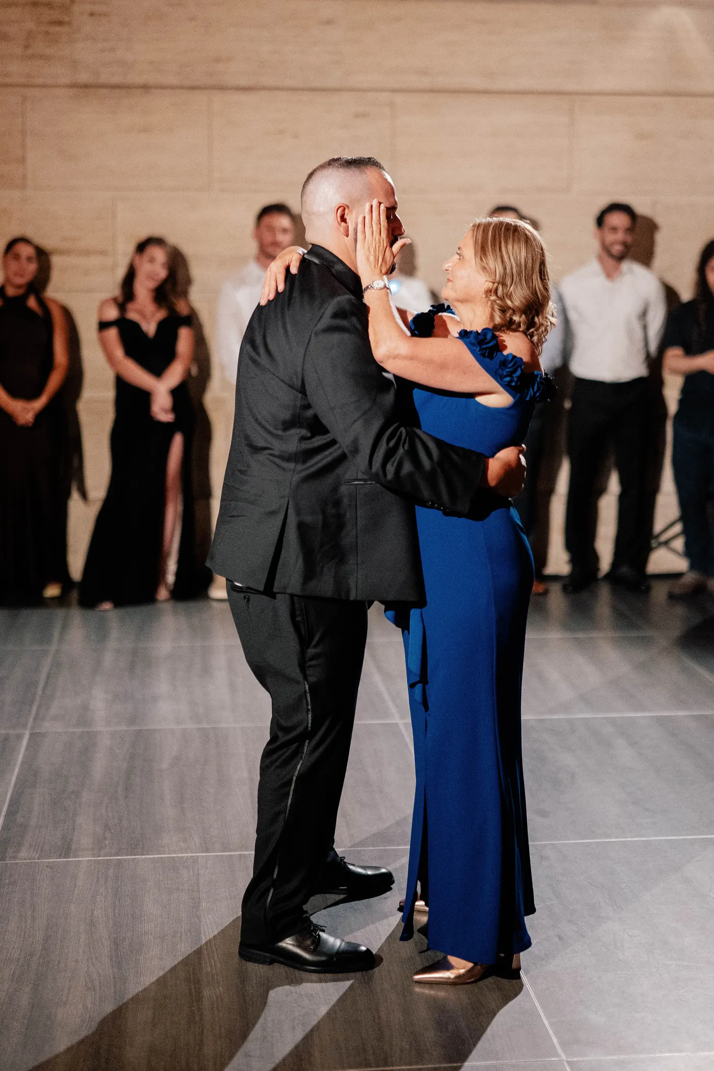 Simon and his mom smiling during their dance