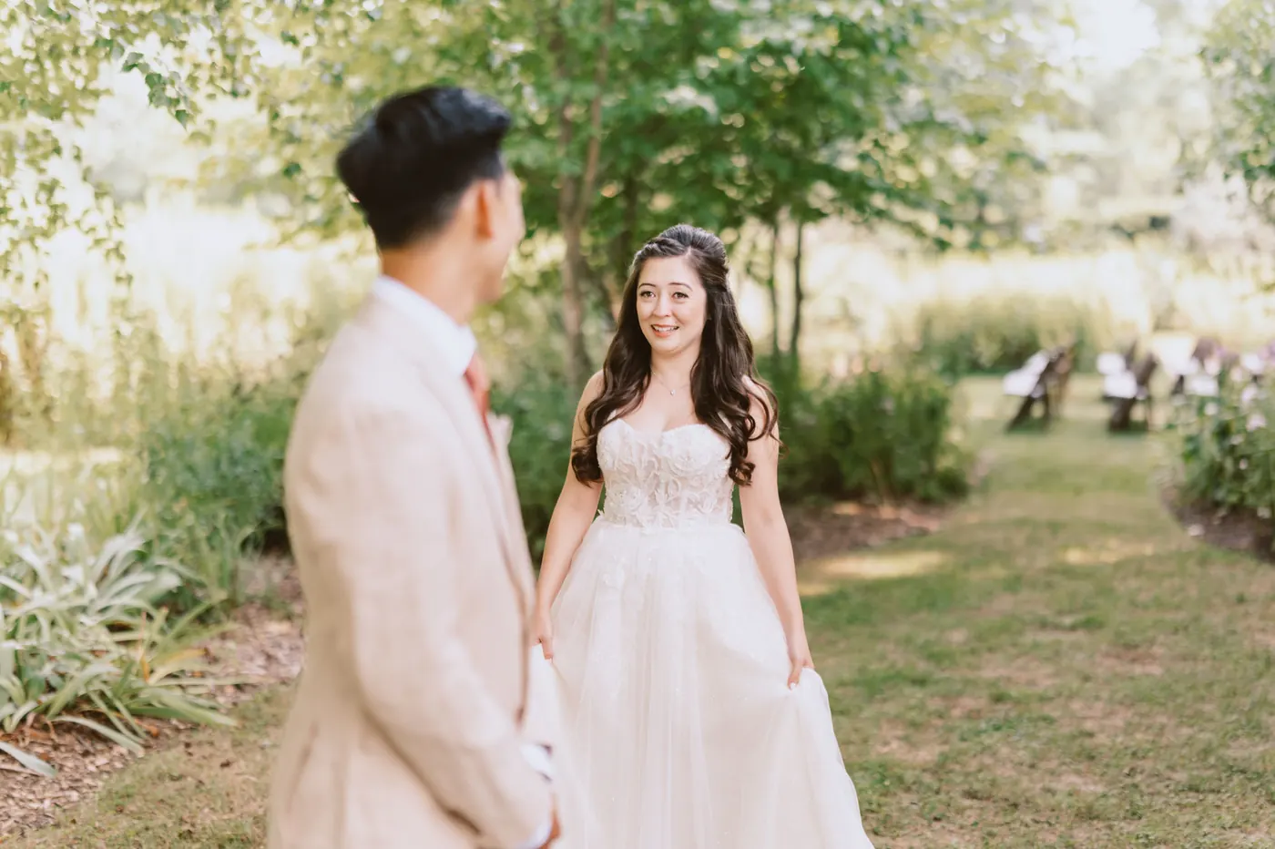 Ivan turning to see Camille for the first time on the garden path