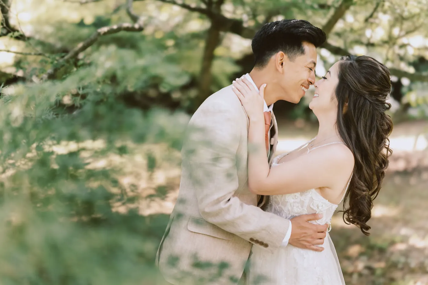 Ivan and Camille embracing and smiling in the garden