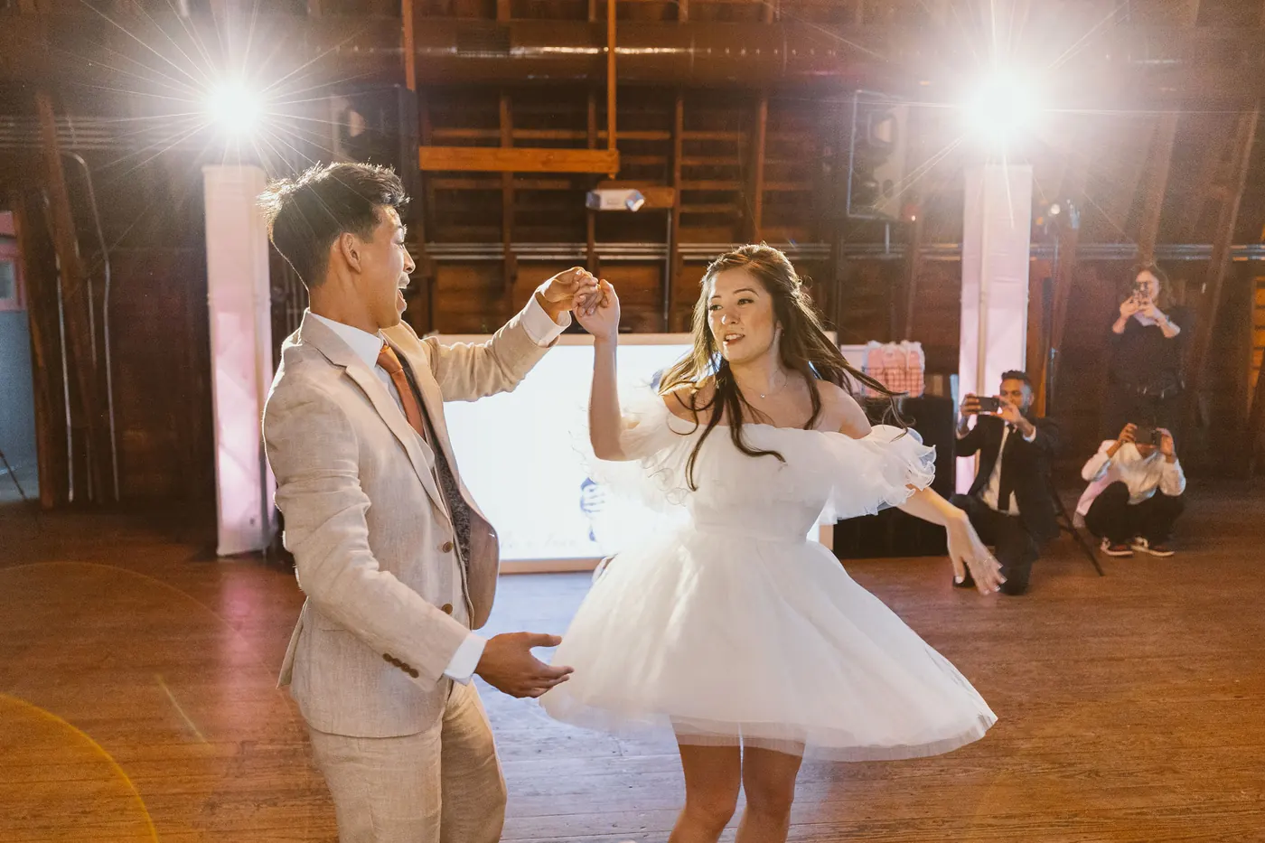 Ivan twirling Camille in her ruffled reception dress