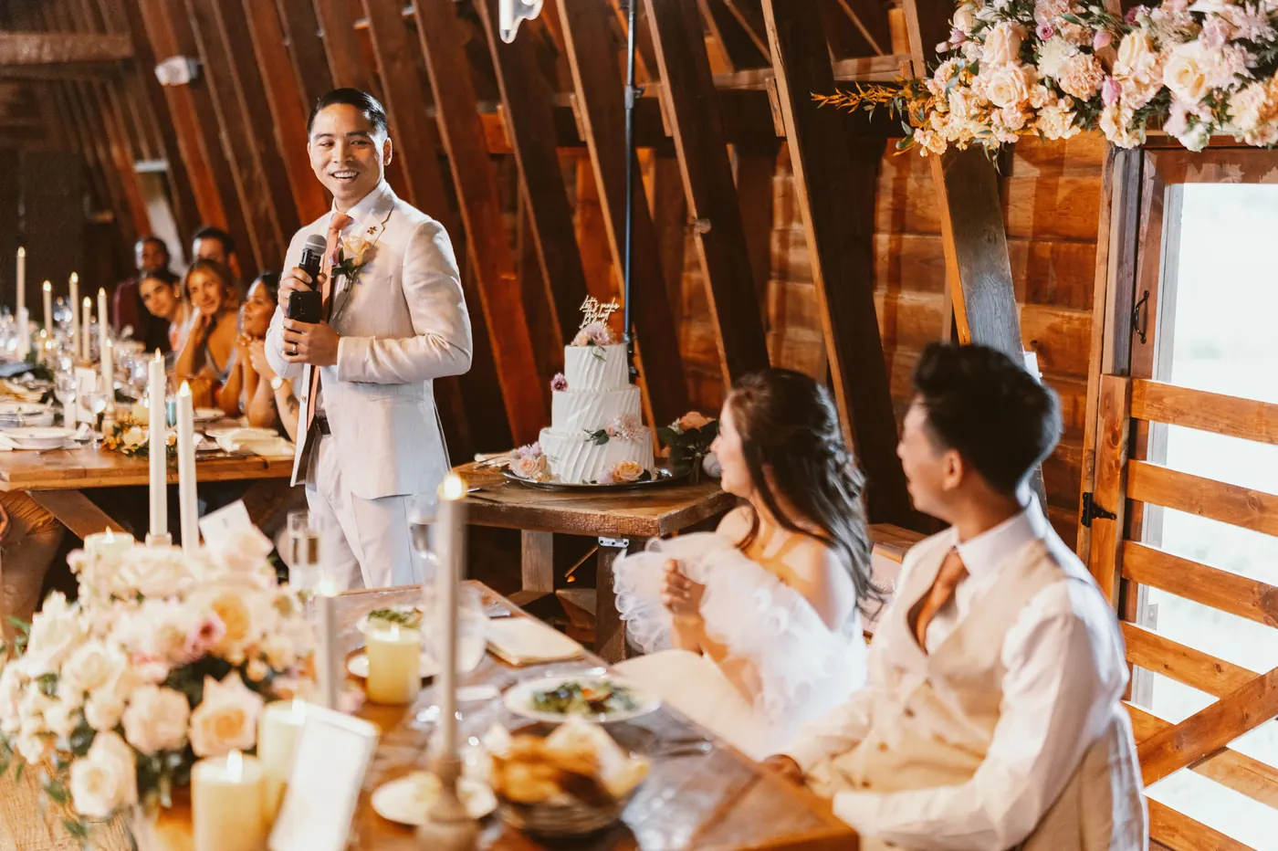 Ivan giving a speech in the barn as Camille looks on