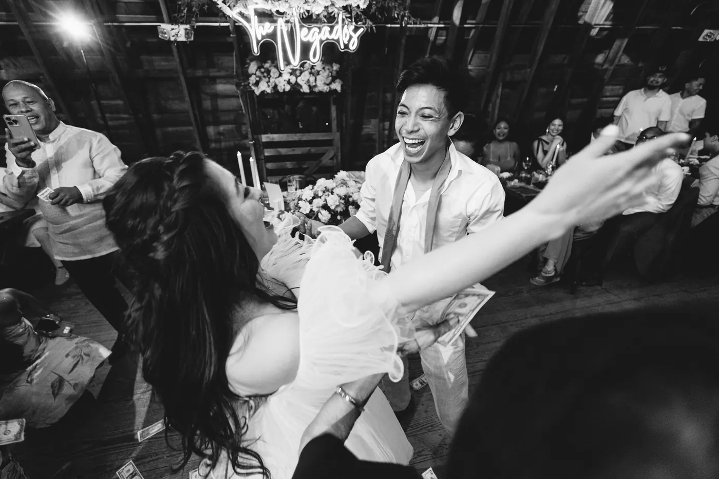 Black and white photo of Camille and Ivan during the money dance