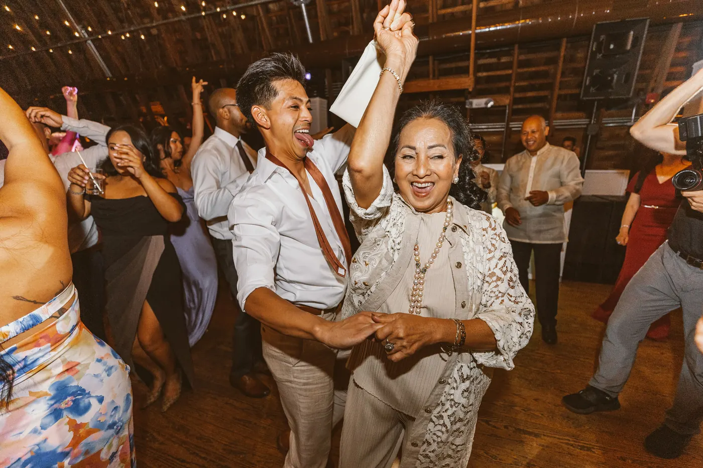 Ivan dancing with a family member on the barn dance floor