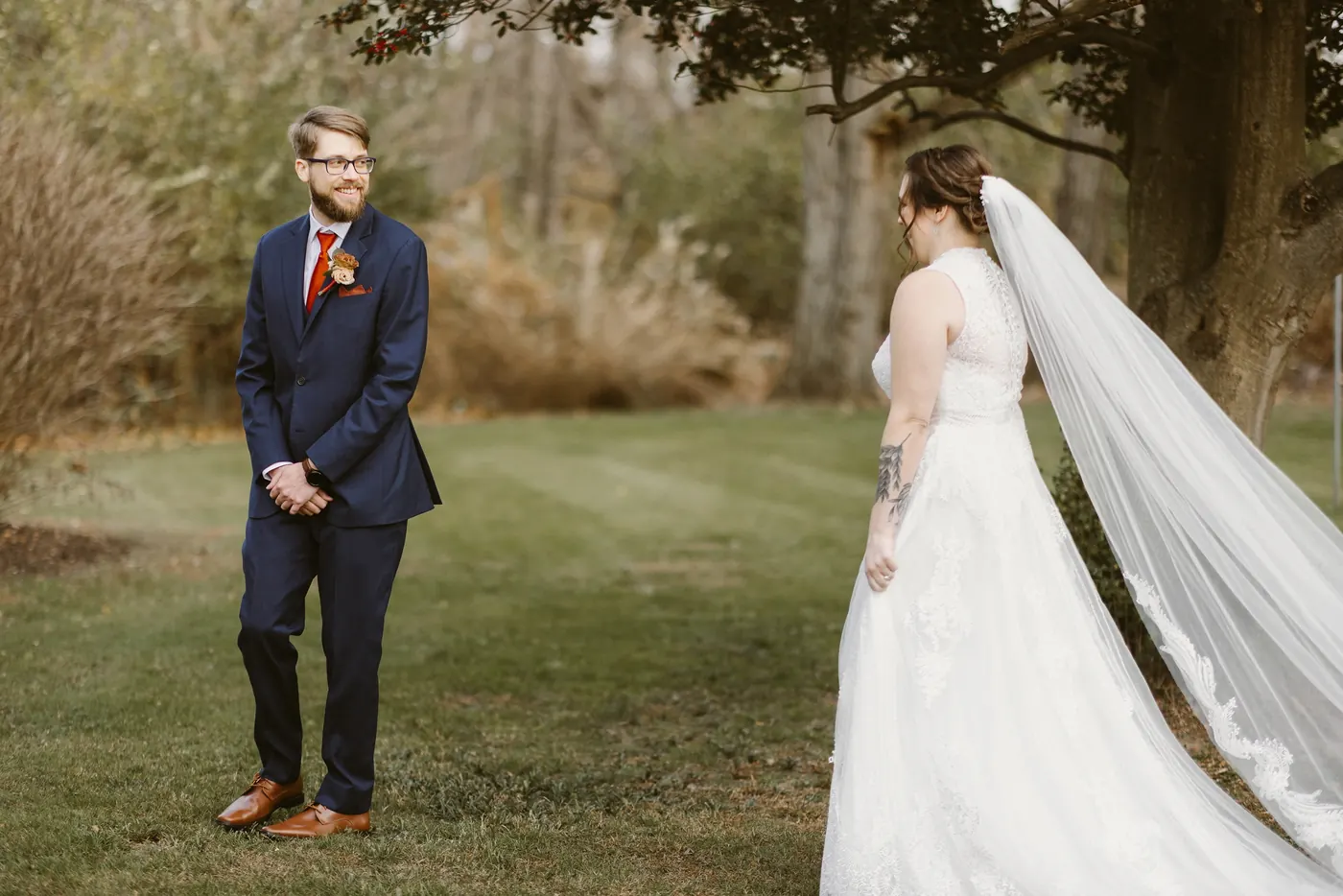 Jimmy waiting with his back turned as Kelsey walks up for their first look
