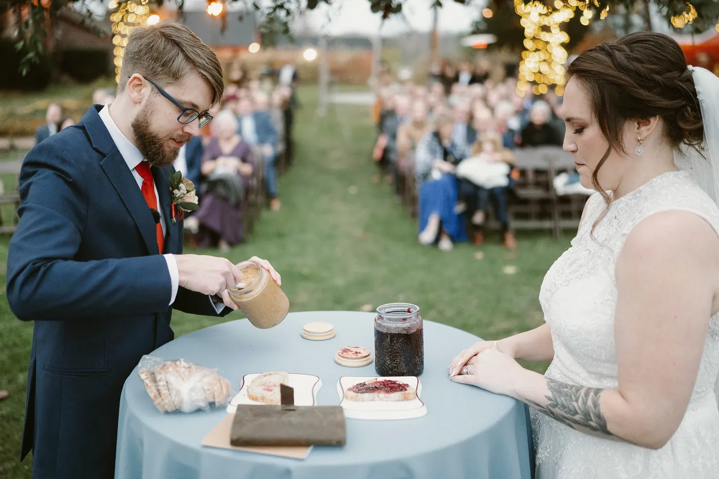 Jimmy spreading peanut butter as Kelsey watches during their unity ceremony