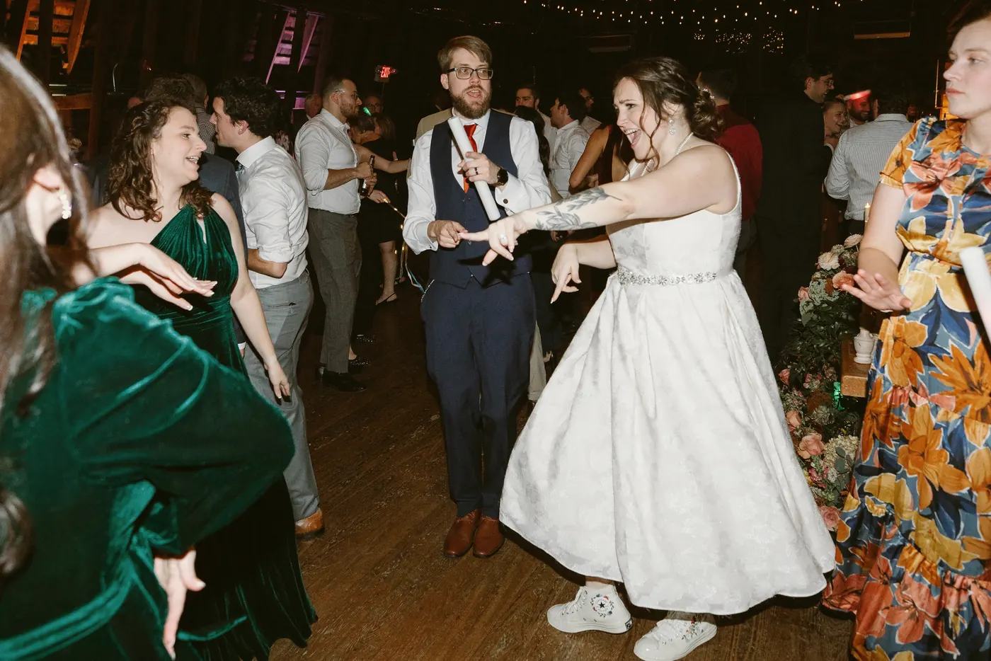 Kelsey dancing with friends on the barn dance floor