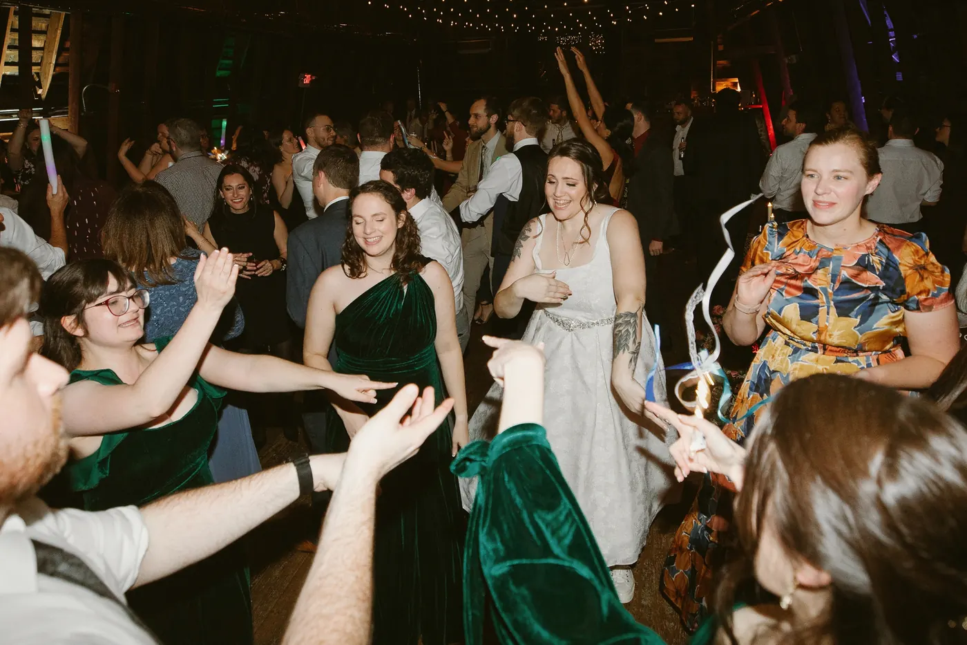 Kelsey surrounded by friends on the packed dance floor