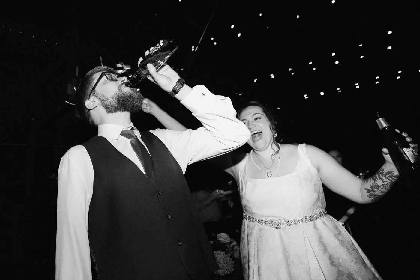 Black and white photo of Jimmy and Kelsey celebrating on the dance floor