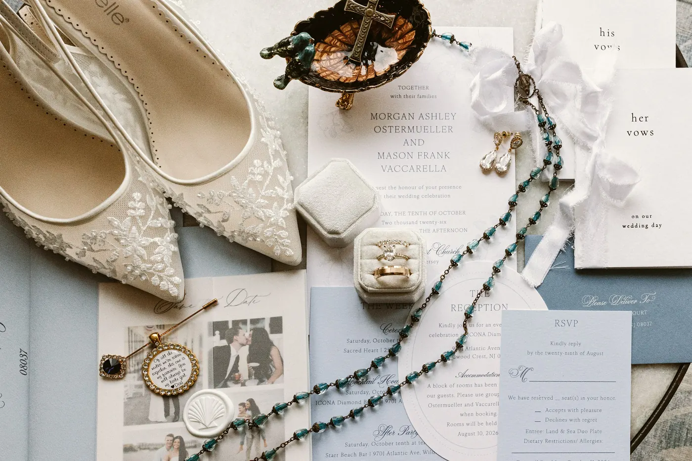 Wedding invitation suite with lace bridal shoes, rings and a rosary for Morgan and Mason's ICONA Diamond Beach wedding
