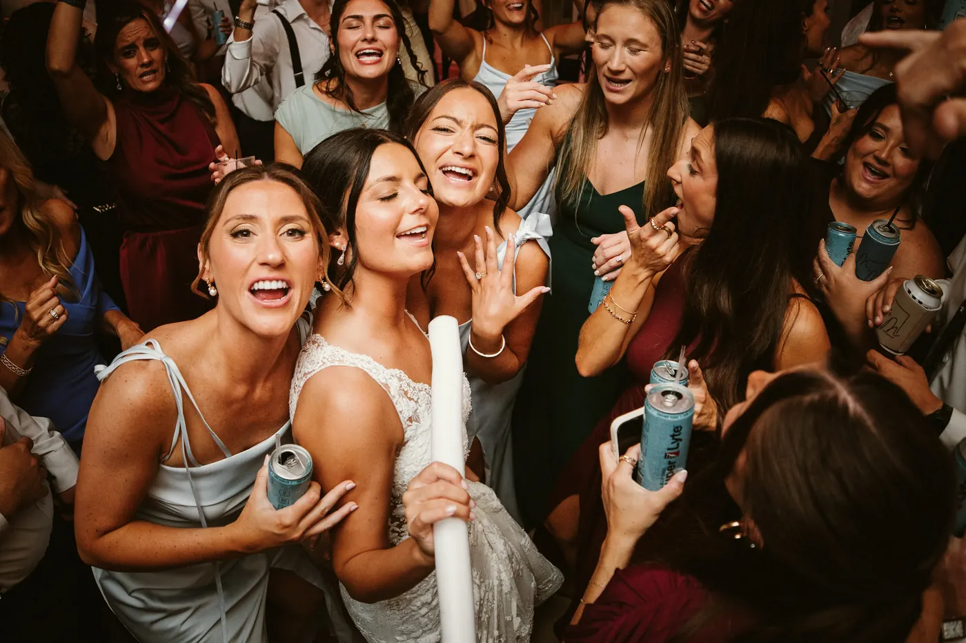 Morgan singing with her bridesmaids on the dance floor