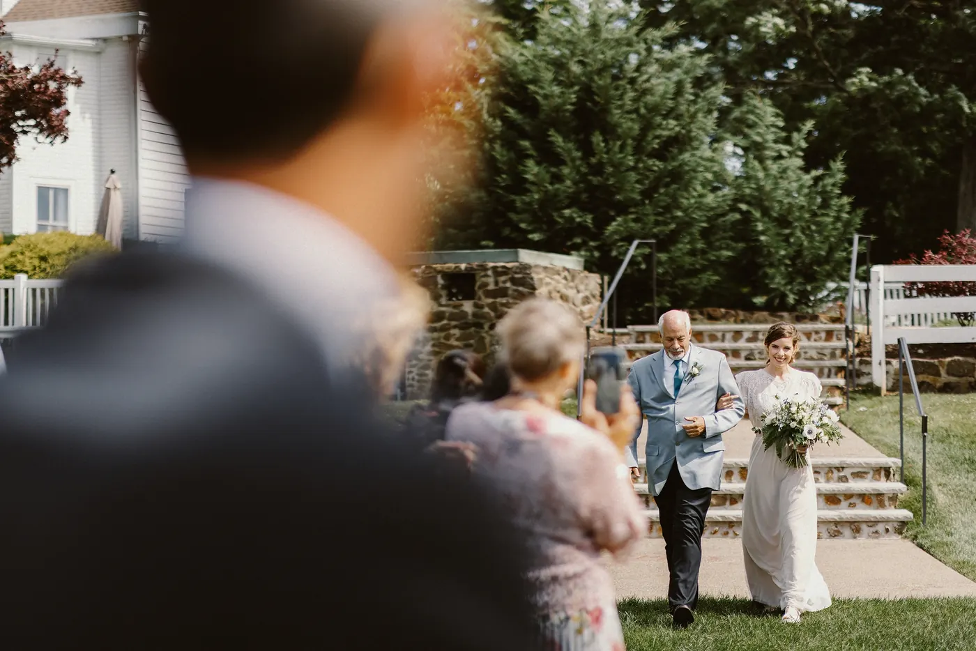 Erica walking down the aisle with her father as Matt waits at Johnson's Locust Hall Farm in Jobstown, NJ