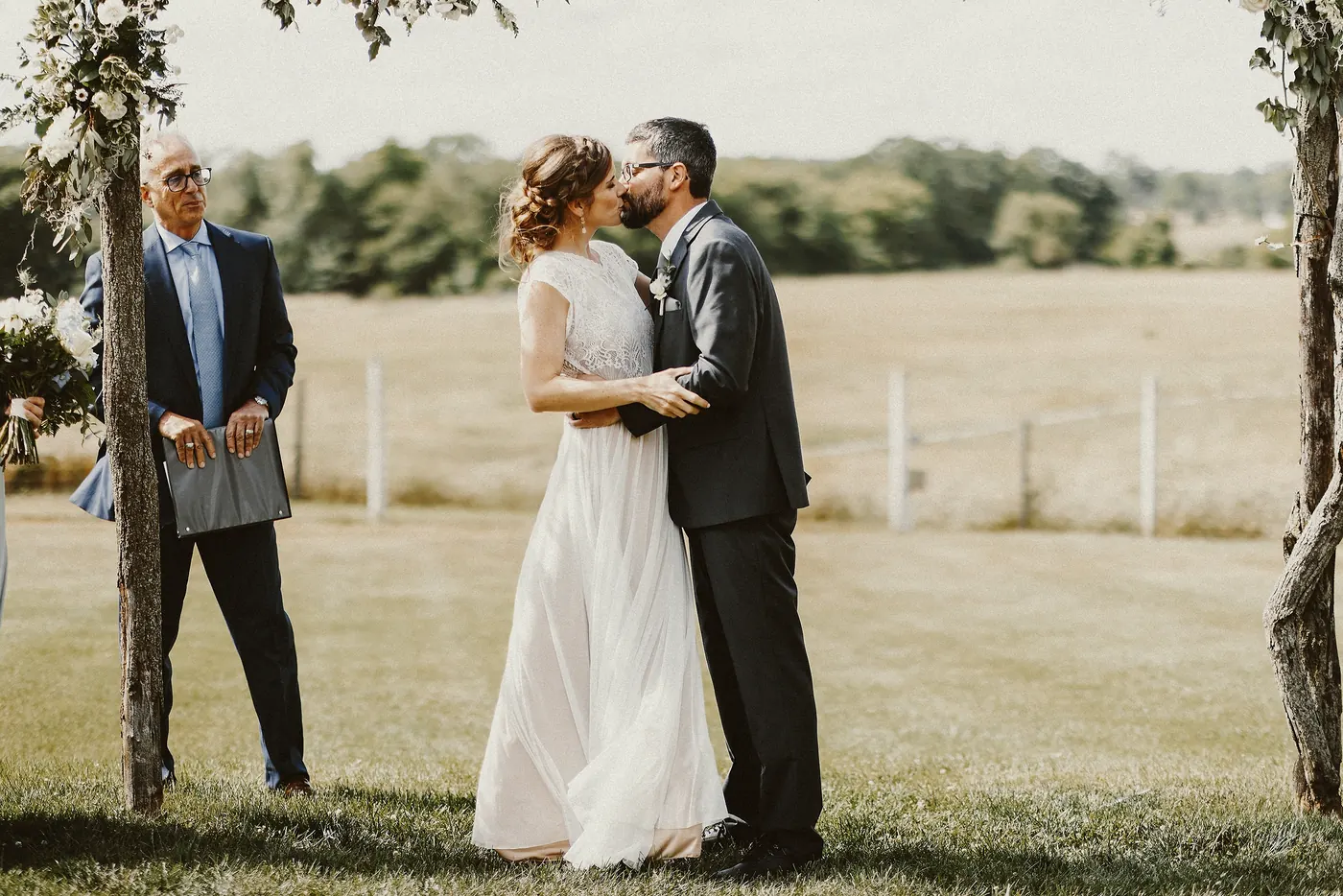 Matt and Erica's first kiss as a married couple under the arbor at Johnson's Locust Hall Farm in Jobstown, NJ