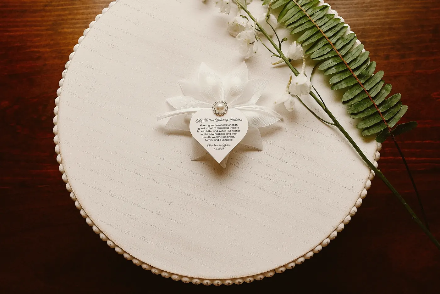 A heart-shaped detail on top of the wedding cake