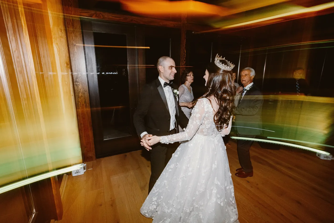 Steve and Maria dancing as warm light streaks across the room