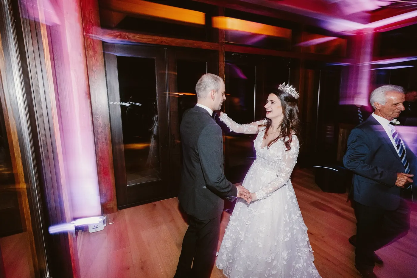Steve and Maria dancing under purple and pink lights