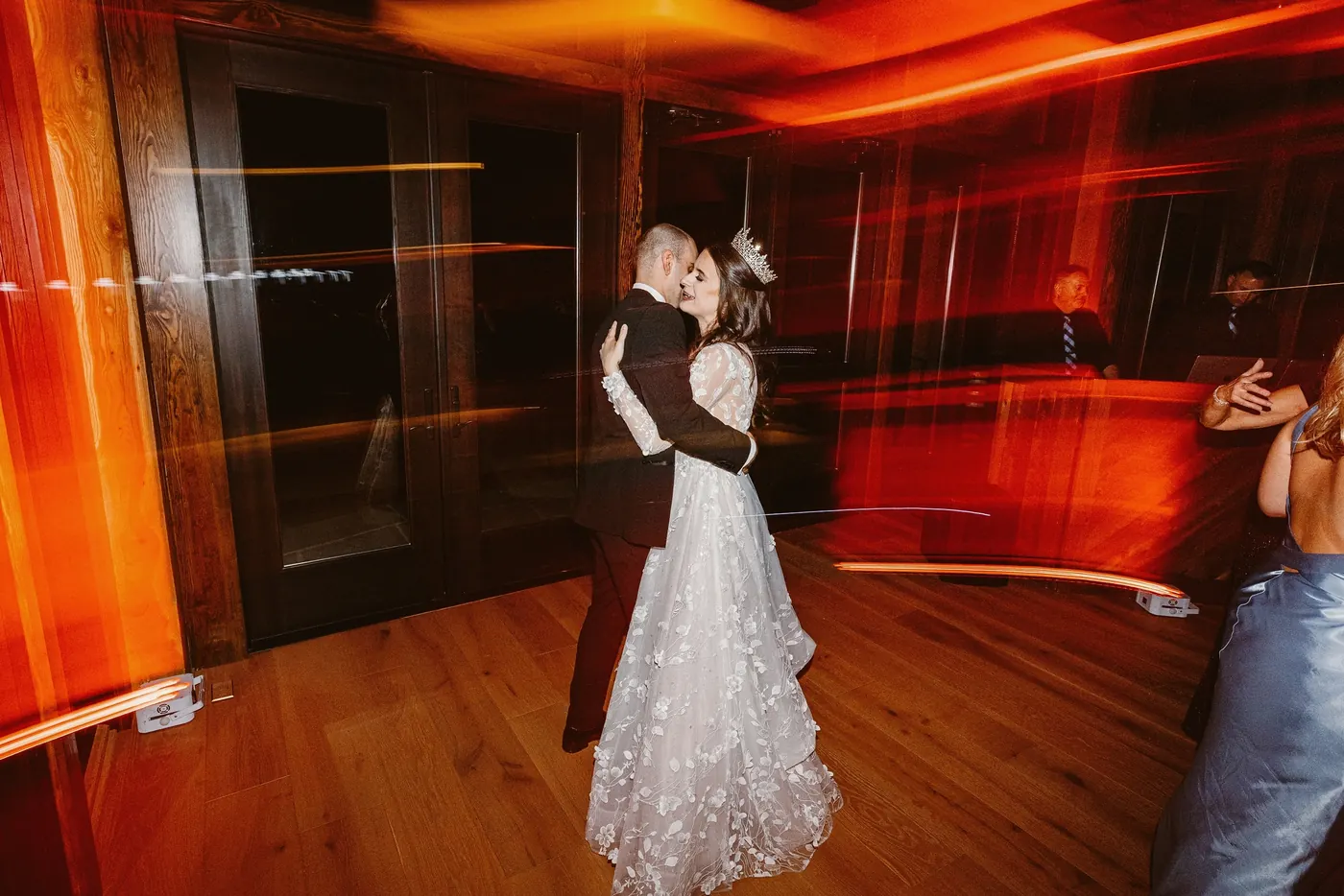 Steve and Maria slow dancing in red light
